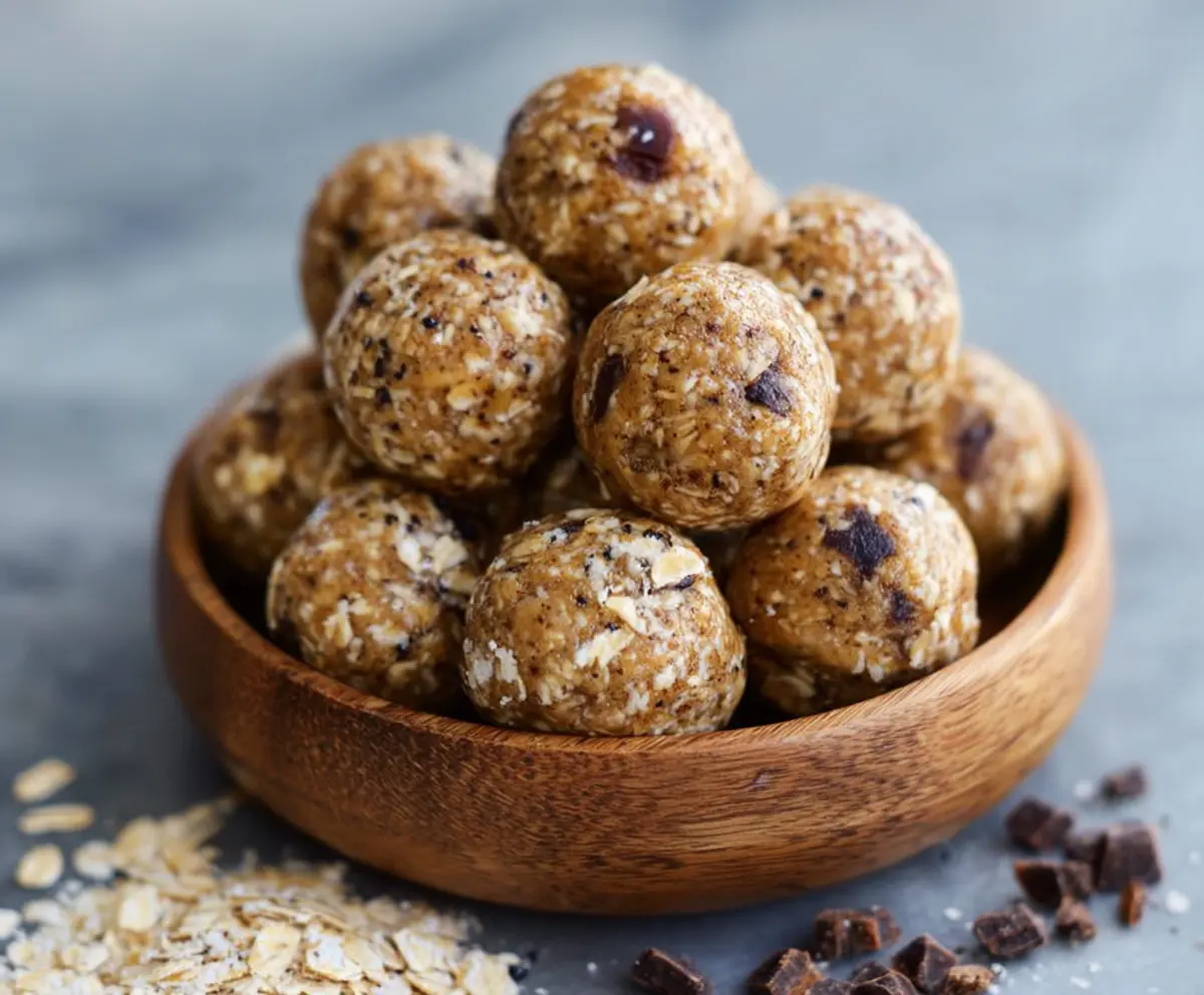 Homemade peanut butter banana protein balls on a white plate, perfect healthy snack recipe.