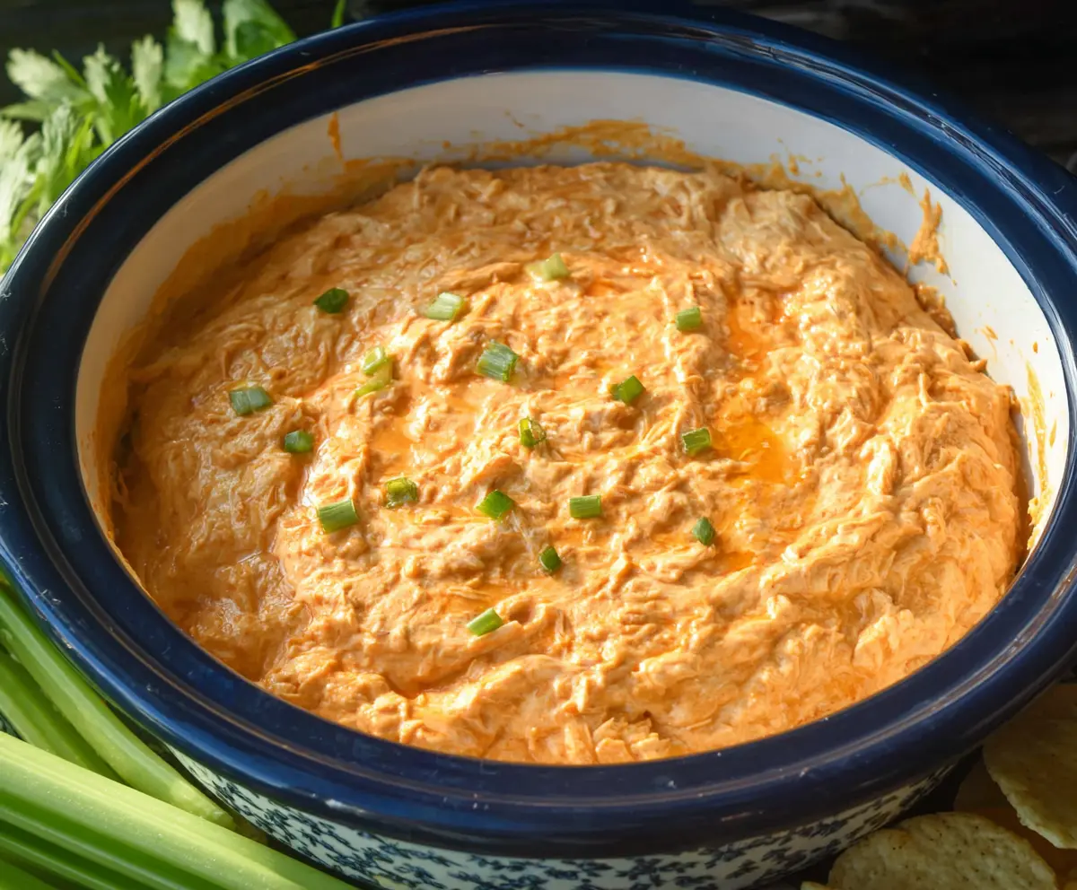 Creamy Crock Pot Buffalo Chicken Dip served with tortilla chips, perfect for parties.