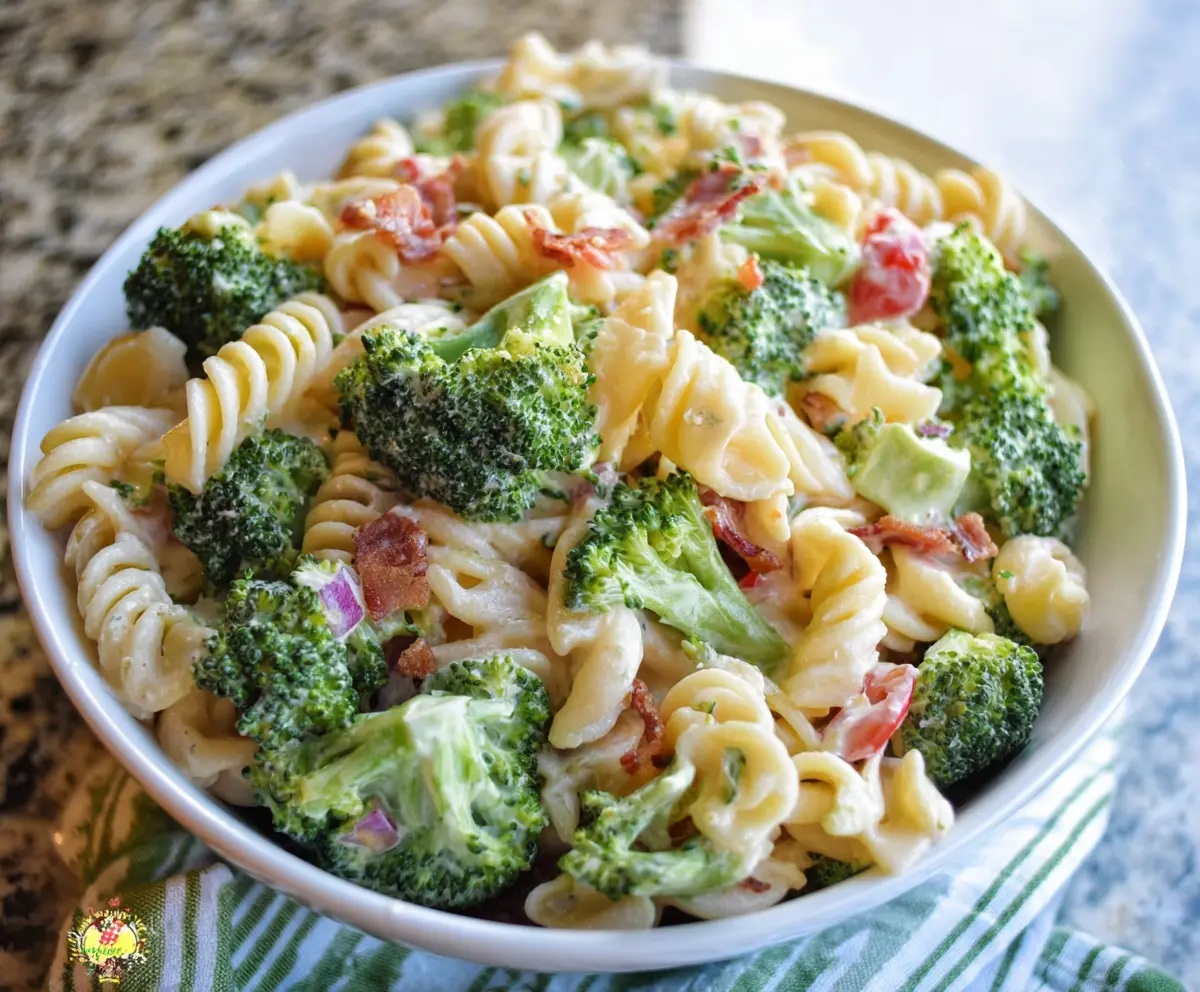 Fresh broccoli pasta salad with colorful vegetables and a zesty dressing